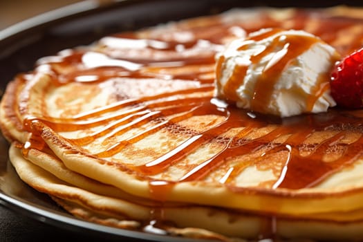 Close up Vanilla ice cream on waffles drizzled with caramel sauce and nuts.