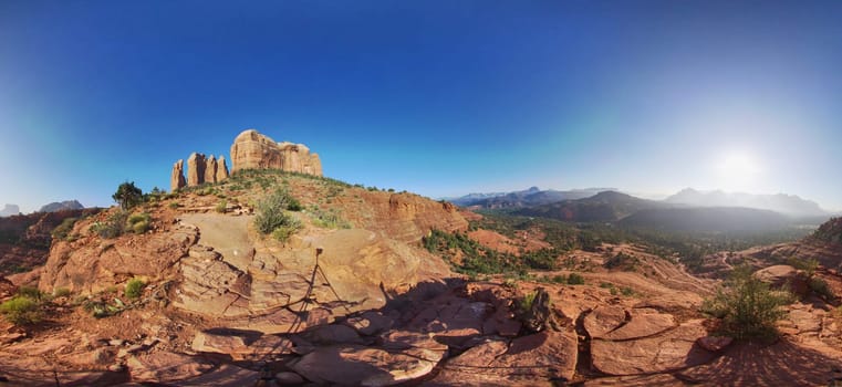 Panoramic capture of majestic red rock formations under a clear blue sky in Sedona, Arizona, 2016 - a testament to nature's rugged beauty.