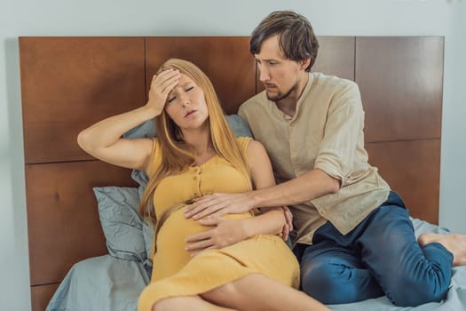 Expectant woman feels unwell, husband comforts and reassures her during a challenging pregnancy.