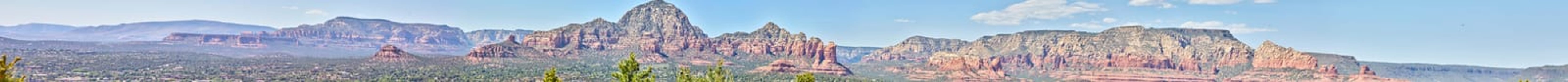 Panoramic view of Sedona's rugged mountain terrain under clear blue sky, Arizona 2016