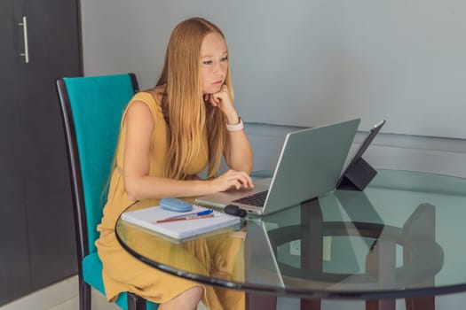 Beautiful pregnant woman working on laptop. Young businesswoman working in her office.