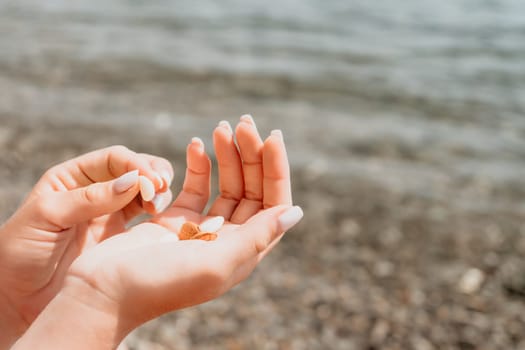 Woman eating milky almond nuts. A young caucasian woman choping fresh green almond after morning fitness yoga near sea. Only hands are visibly. Healthy vegan food. Slow motion. Close up