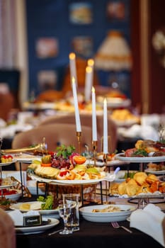 Savor a buffet of delectable treats in a candlelit setting. Perfect for special occasions or romantic evenings, this enchanting ambiance guarantees an unforgettable dining experience.