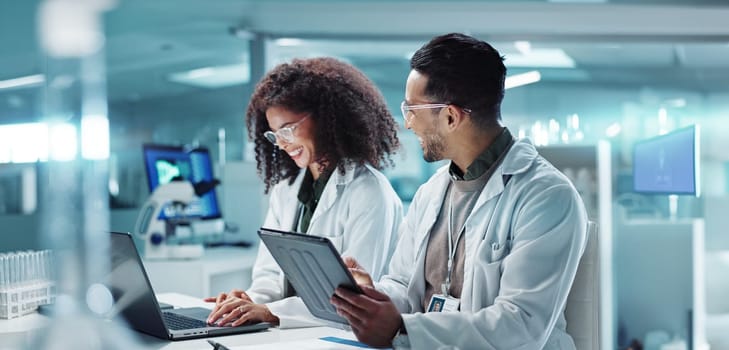 Science, teamwork and laptop with laughing in laboratory for communication, pharmaceutical review or planning. Employees, collaboration and technology for research, discussion and digital analysis.