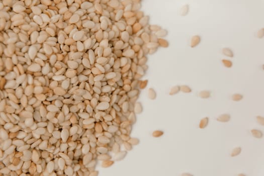 sesame seeds. Pile of white sesame seeds as background, top view.