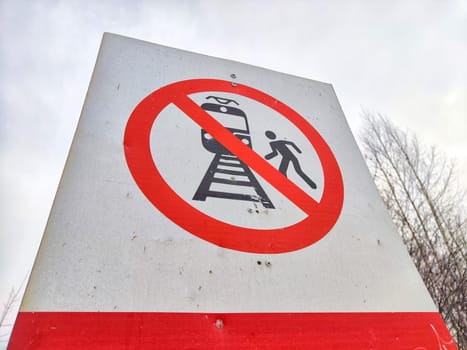 A sign not to walk on railway tracks. Railway Crossing Not Allowed or Walking on Railroad Prohibited. Russia