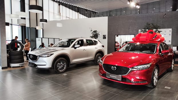 Cheboksary, Russia - March 20, 2023: Cars in showroom of dealership Mazda