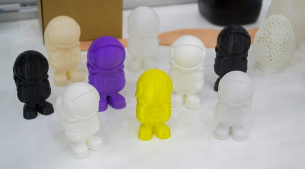 Many object model printed on a 3D printer from molten plastic. 3D printer printed prototype of toy from molten plastic. 3D design and prototyping.