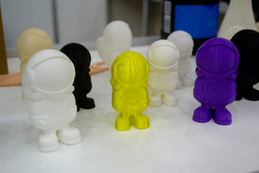 Many object model printed on a 3D printer from molten plastic. 3D printer printed prototype of toy from molten plastic. 3D design and prototyping.