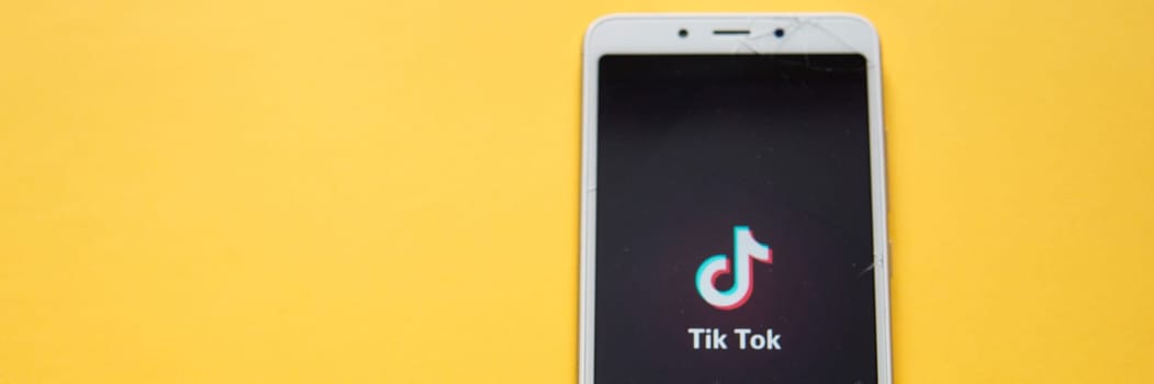 Tver, Russia - February 12, 2020 Tik tok logo on smartphone screen on green background. Tik Tok icon. tik tok application. Tiktok Social media network.
