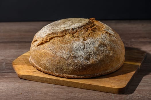 homemade whole grain bread in the kitchen on a wooden table 1