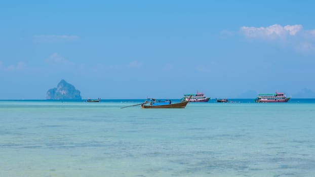 Koh Kradan is a tropical island with palm trees soft white sand, and a turqouse colored ocean in Koh Kradan Trang Thailand