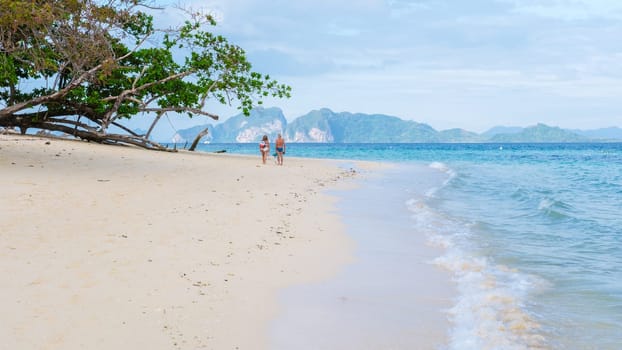 Koh Kradan is a tropical island with palm trees soft white sand, and a turqouse colored ocean in Koh Kradan Trang Thailand