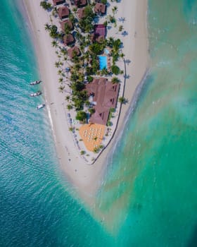 Top view at Koh Muk a tropical island with palm trees and soft white sand, and a turqouse colored ocean in Koh Mook Trang Thailand