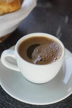 a cup of turkish coffee on table .