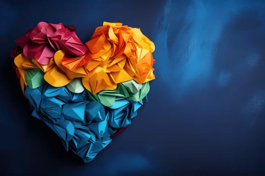 Image of a heart in rainbow colors on a blue background with space for text. LGBT pride symbol.