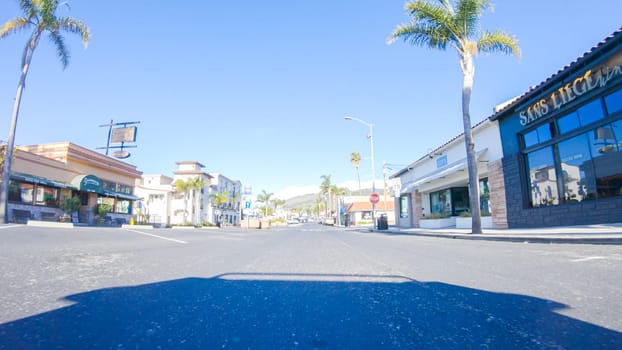 Santa Maria, California, USA-December 6, 2022-Car driving through the streets of Pismo Beach town, California during winter.