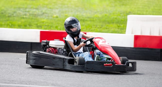 Little Girl Drives Fast Kid'S Go-Kart By Racing Track