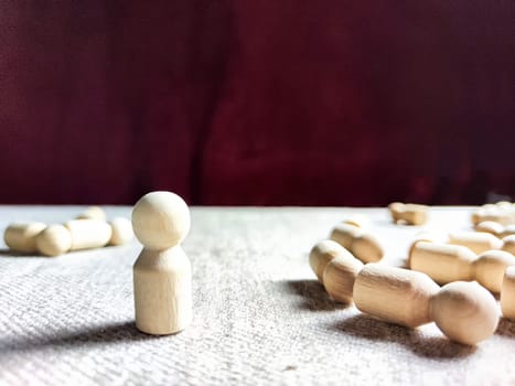 A lot of lying wooden toys and one standing one. There is an opportunity to win even when others give up. The strongest ones win. The loneliness of leader in business