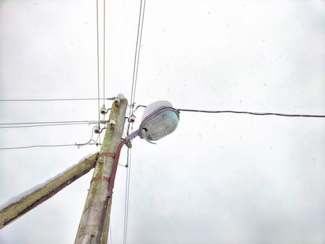 Old pole with wires against the sky. Electric transmission line, Eco-friendly energy