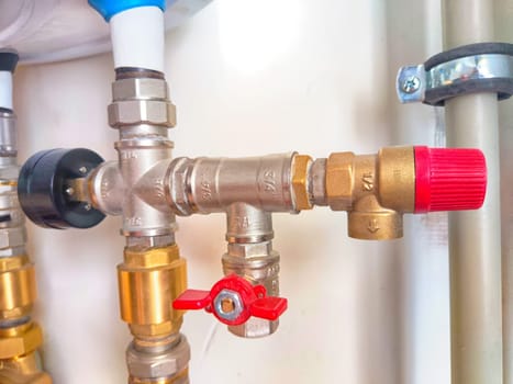 Close-Up of Domestic Water Shut-Off Valves. detailed view of the copper piping and two types of water shut-off valves typically installed in home plumbing system