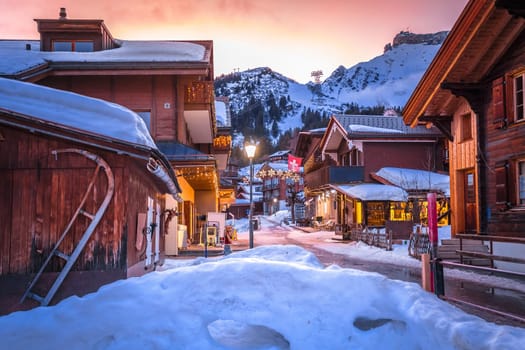 Idyllic Alpine village of Murren street sundown view, Berner Oberland region of Switzerland