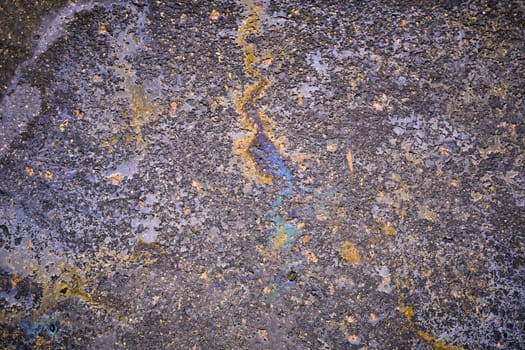 Oil stain, Gas Stain drop from the Car on the Parking Lot Floor. Environmental pollution concept