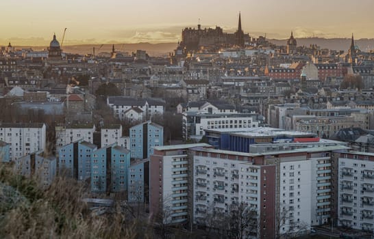 Edinburgh, Scotland - Jan 17, 2024 - Amazing Edinburgh cityscape view and Calton Hill and buildings in Dumbiedykes with the skyline seen from the top of Salisbury Crags. Destinations in Europe, Space for text, Selective focus.