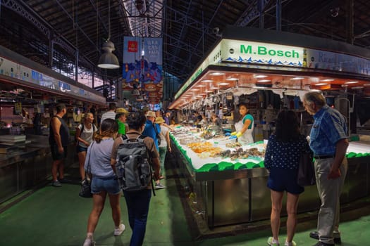 Barclona, Spain - July 24 2017: Mercat de Sant Josep de la Boqueria public food market landmark interior shops with crowd in Catalonia.