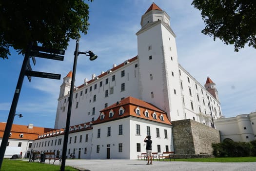Bratislava, Slovakia, August 25, 2023: White castle building on sunny day. High quality photo