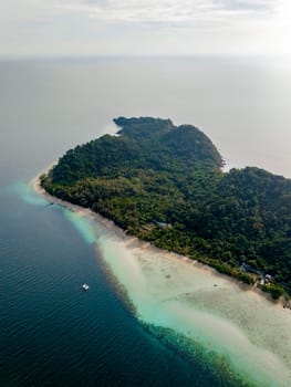 Drone top aerial view at Koh Kradan a tropical island with a turqouse colored ocean in Koh Kradan Trang Thailand