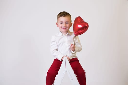 Little children with air balloons on white background. Valentine's Day Celebration.