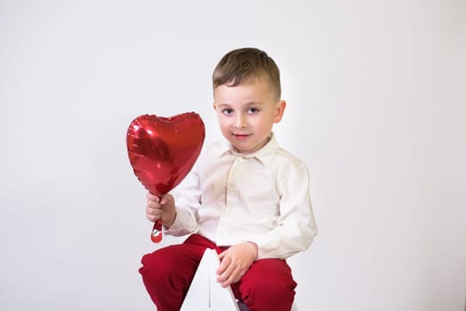 Little children with air balloons on white background. Valentine's Day Celebration.