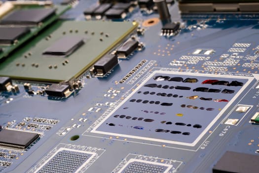 AI and artists copyright conflict concept. A PCB motherboard featuring a painter's palette in tech style on the circuit board, symbolizing the conflict at the intersection of technology and human artistic creativity. Selective focus.