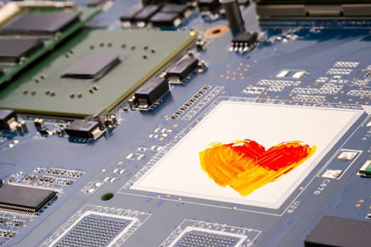 AI and artists conflict copyright concept. A PCB motherboard featuring a heart design, symbolizing the conflict at the intersection of technology and human artistic creativity. Selective focus.
