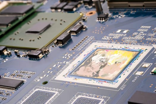 AI and artists copyright conflict concept. A PCB motherboard featuring a painter's palette, symbolizing the conflict at the intersection of technology and human artistic creativity. Selective focus.
