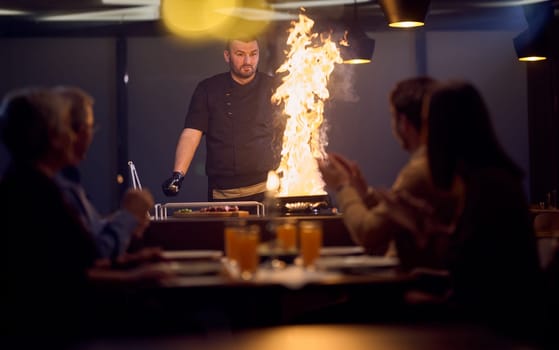 In a restaurant setting, a professional chef presents a sizzling steak cooked over an open flame, while an European Muslim family eagerly awaits their iftar meal during the holy month of Ramadan, blending culinary artistry with cultural tradition in a harmonious dining experience.