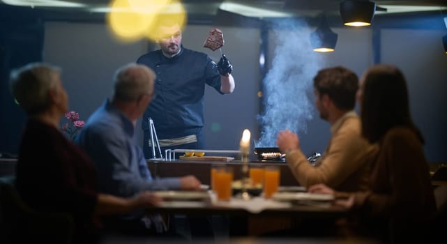 In a restaurant setting, a professional chef presents a sizzling steak cooked over an open flame, while an European Muslim family eagerly awaits their iftar meal during the holy month of Ramadan, blending culinary artistry with cultural tradition in a harmonious dining experience.