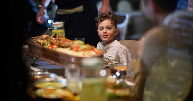 In a heartwarming scene, a professional chef serves an European Muslim family their iftar meal during the holy month of Ramadan, embodying cultural unity and culinary hospitality in a moment of shared celebration and gratitude.