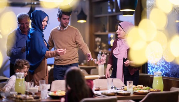 Grandparents arrive at their children's and grandchildren's gathering for iftar in a restaurant during the holy month of Ramadan, bearing gifts and sharing cherished moments of love, unity, and cultural exchange, as they eagerly await their meal together.