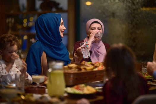 A modern and traditional European Islamic family comes together for iftar in a contemporary restaurant during the Ramadan fasting period, embodying cultural harmony and familial unity amidst a culinary celebration of diversity.