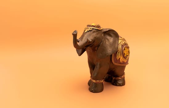 Design Bronze Decorated Elephant On Peach Yellow Background. World Elephant Day. Copy Space, Postal Card. Ganesha Chaturthi Holiday. Sacred Symbol In Hindu And Buddhist Religions. Design, Horizontal.