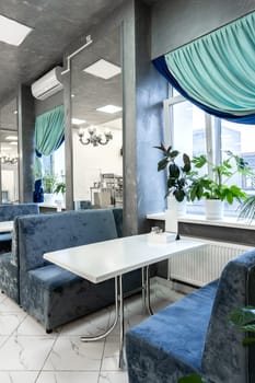 Interior of light colored canteen at the business center no people