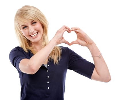 Woman, portrait and heart hands for care in studio, kindness and peace emoji or symbol. Happy female person, support icon and smiling on white background, romance emoticon and gratitude for thank you.