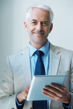 Portrait, man and CEO with tablet in corporate for networking, communication or task management with confident smile. Male person, boss and technology for planning, agenda or research in office.