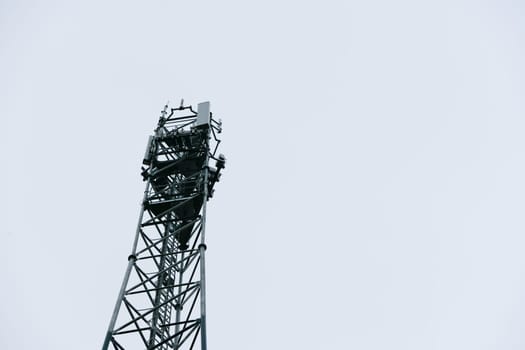 Deployment of the 5G network. Laying antennas on a mobile phone mast in the winter atmosphere. France, Gironde, February 2024. High quality photo