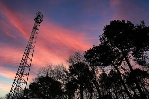 Deployment of the 5G network. Laying antennas on a mobile phone mast in the winter atmosphere. France, Gironde, February 2024. High quality photo