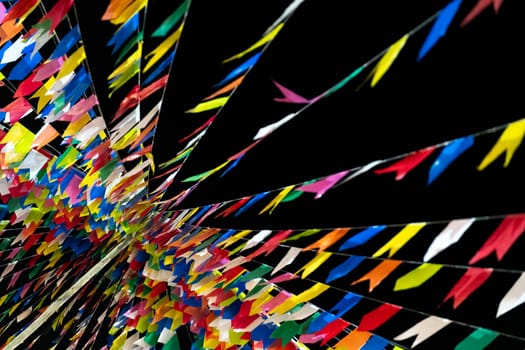 Abstract multicolored ribbon pattern on black background.
