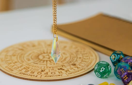 Pendulum numerologist astrologer and zodiac signs. Selective focus. Nature.