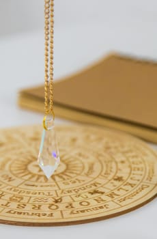 Pendulum numerologist astrologer and zodiac signs. Selective focus. Nature.